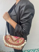 bandolera con pompones 